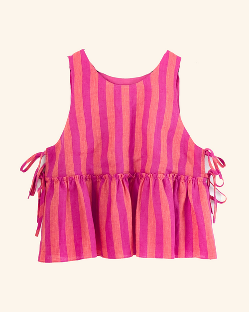 A sleeveless  top with vertical hot pink and coral orange stripes, featuring a ruffled hem and side tie details, shown against a light cream background.